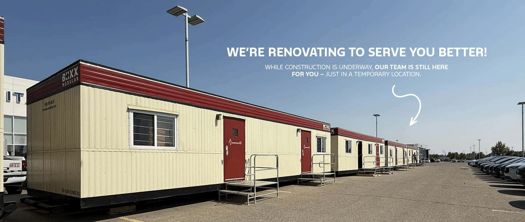 Modular buildings with a sign: "We're renovating to serve you better!" indicating a temporary location.