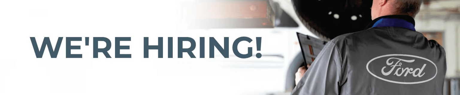 "We're Hiring" text next to a person in a Ford uniform, implying job opportunities at Ford.