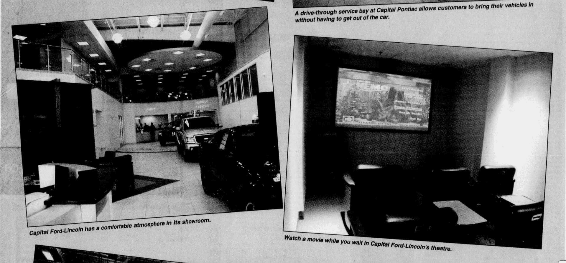 Capital Ford-Lincoln showroom with vehicles, seating area, and a theater displaying a movie screen.