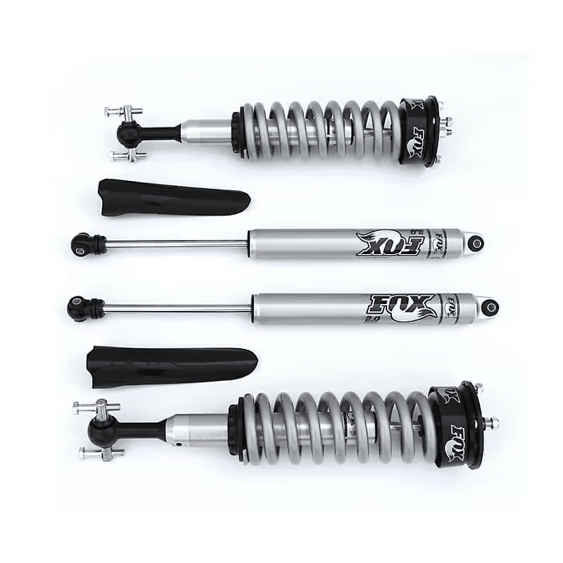 Fox shock absorbers and coil springs laid out against a white background.