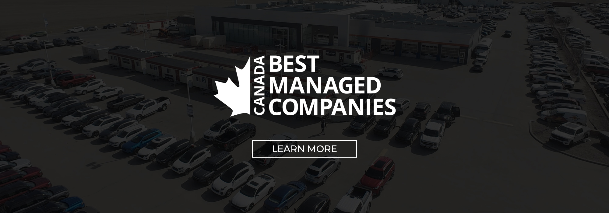 Aerial view of a car dealership lot with "Canada Best Managed Companies" text overlay.